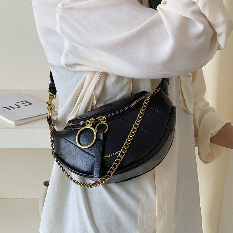 “Rivoli” -  Le sac simili cuir bandoulière, semi banane